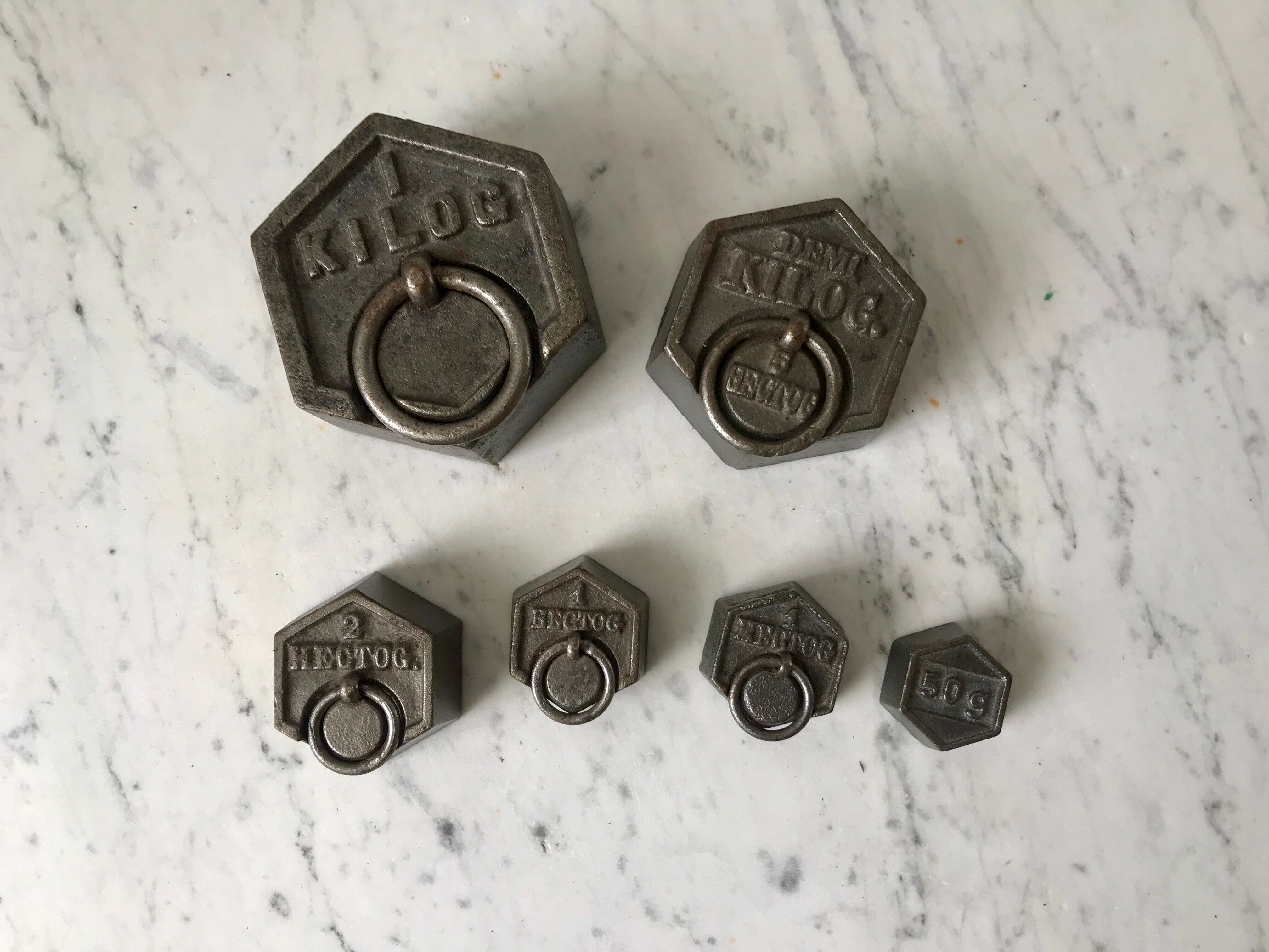 set of old measuring weights early twentieth century