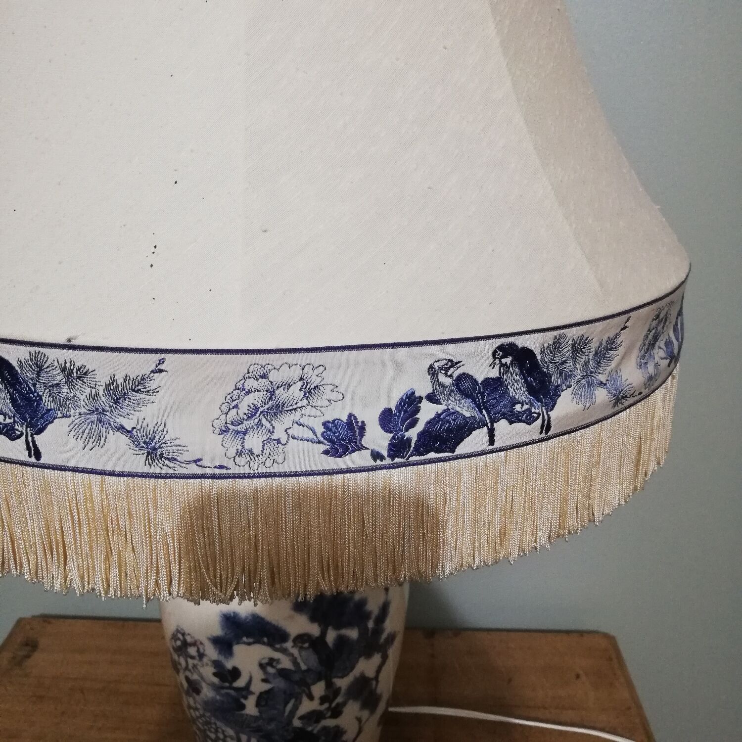 Ceramic lamp with Asian decoration with matching lampshade.