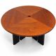 Large round dining table with black blade legs.