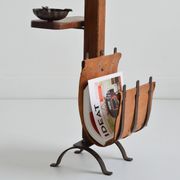 Vintage leather magazine rack with shelf and brutalist/rustic ashtray.