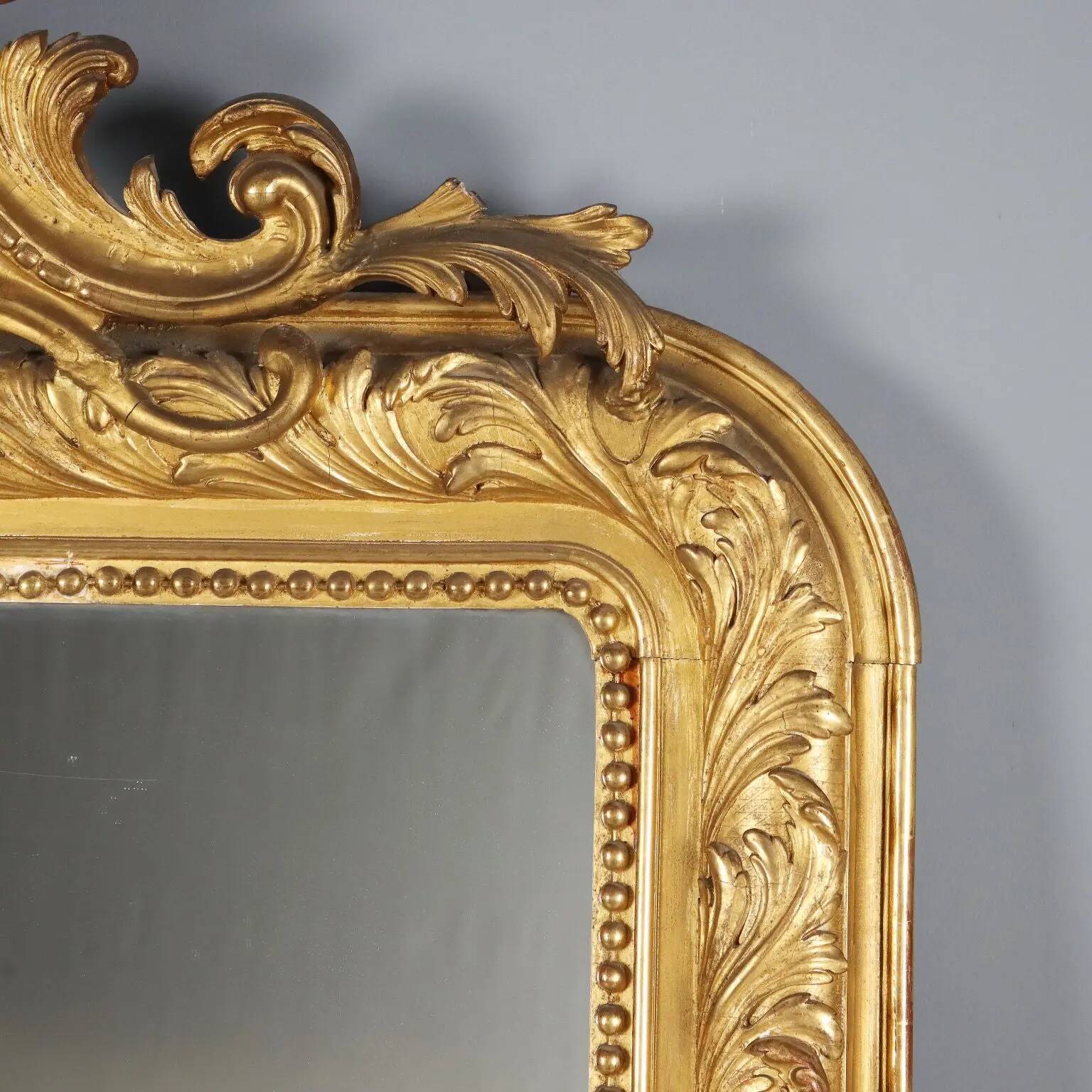 Antique eclectic style mirror in carved and gilded fir, Italy, 19th century.