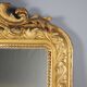 Antique eclectic style mirror in carved and gilded fir, Italy, 19th century.