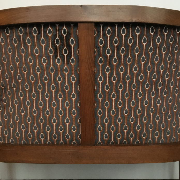 Old wooden and velvet bench