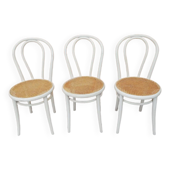 Lot of three Vintage ecru natural cane bistro chairs