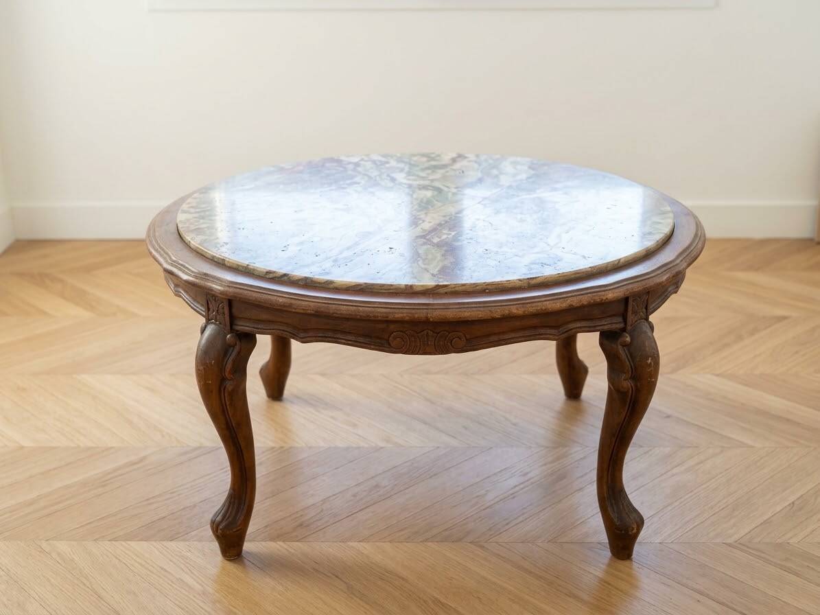 Classic round coffee table in wood with a marble top.