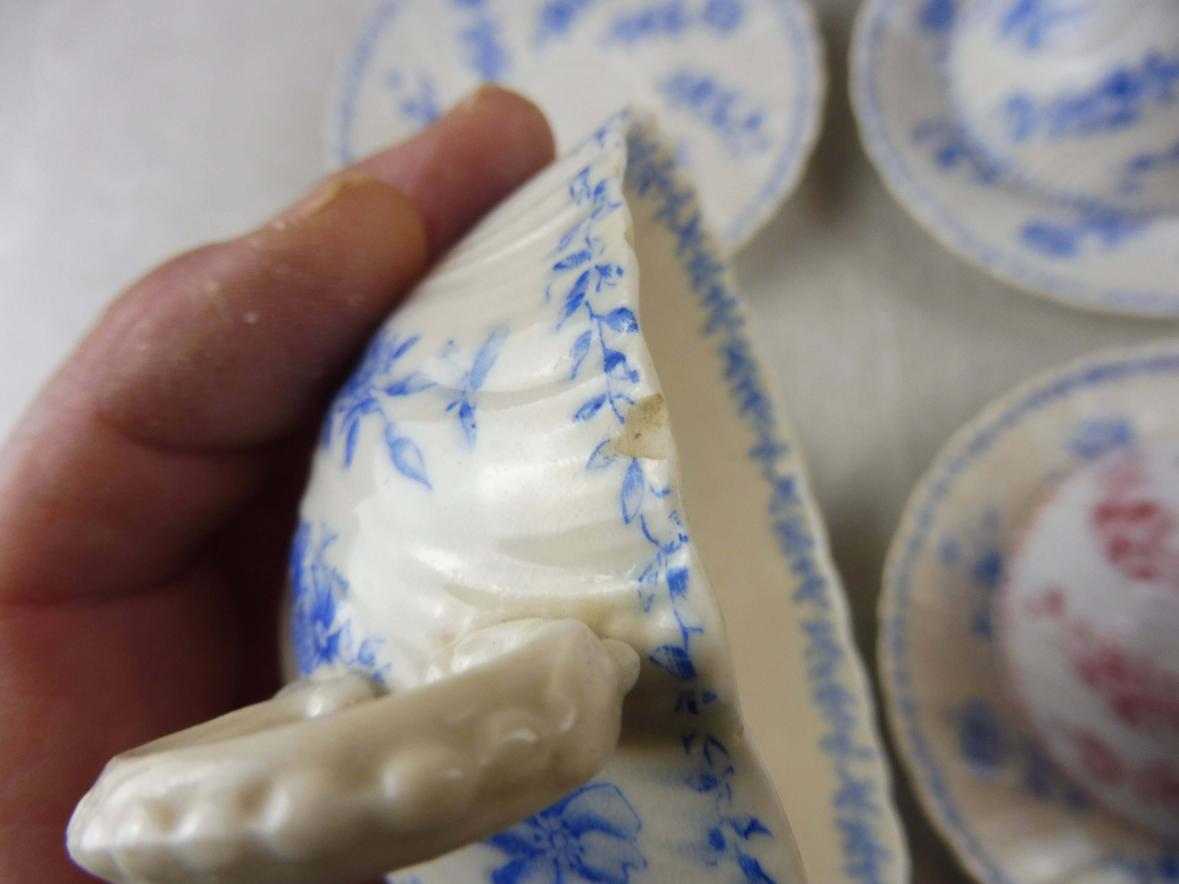 Lot of porcelain cups and under cups, twisted decoration, from Sarreguemines