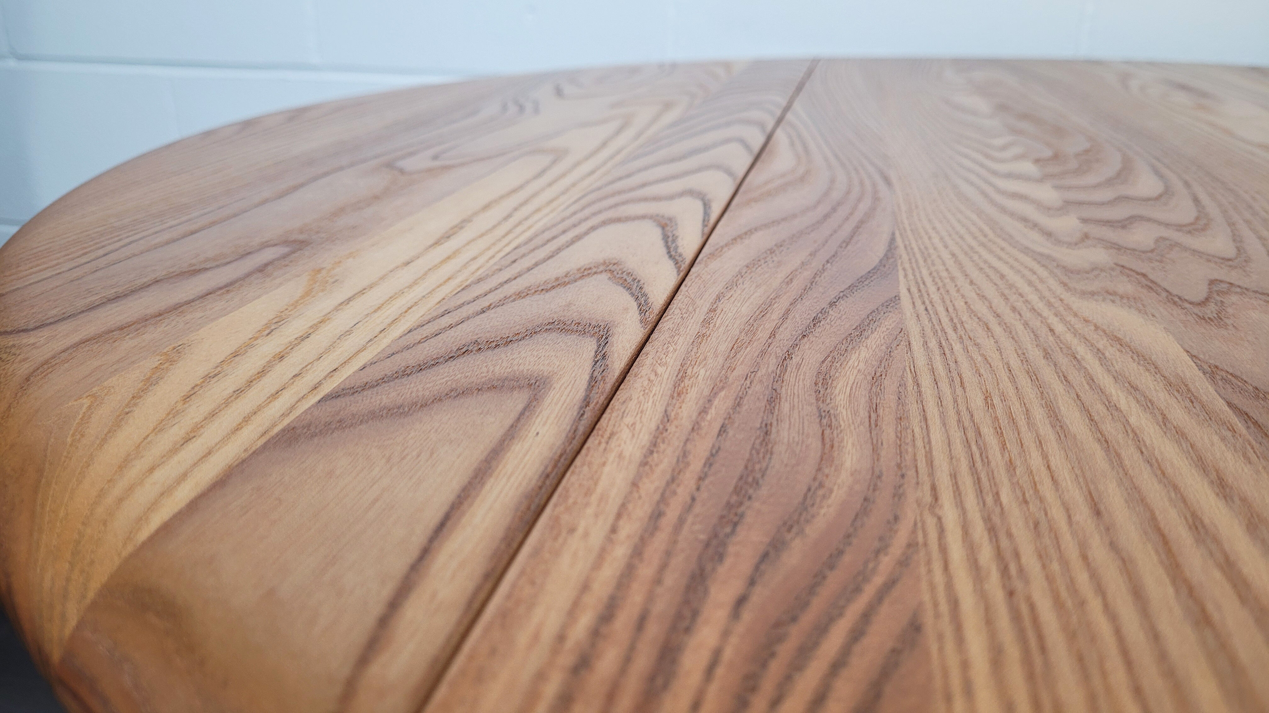 Ercol round drop leaf dining table - black leg, 1960