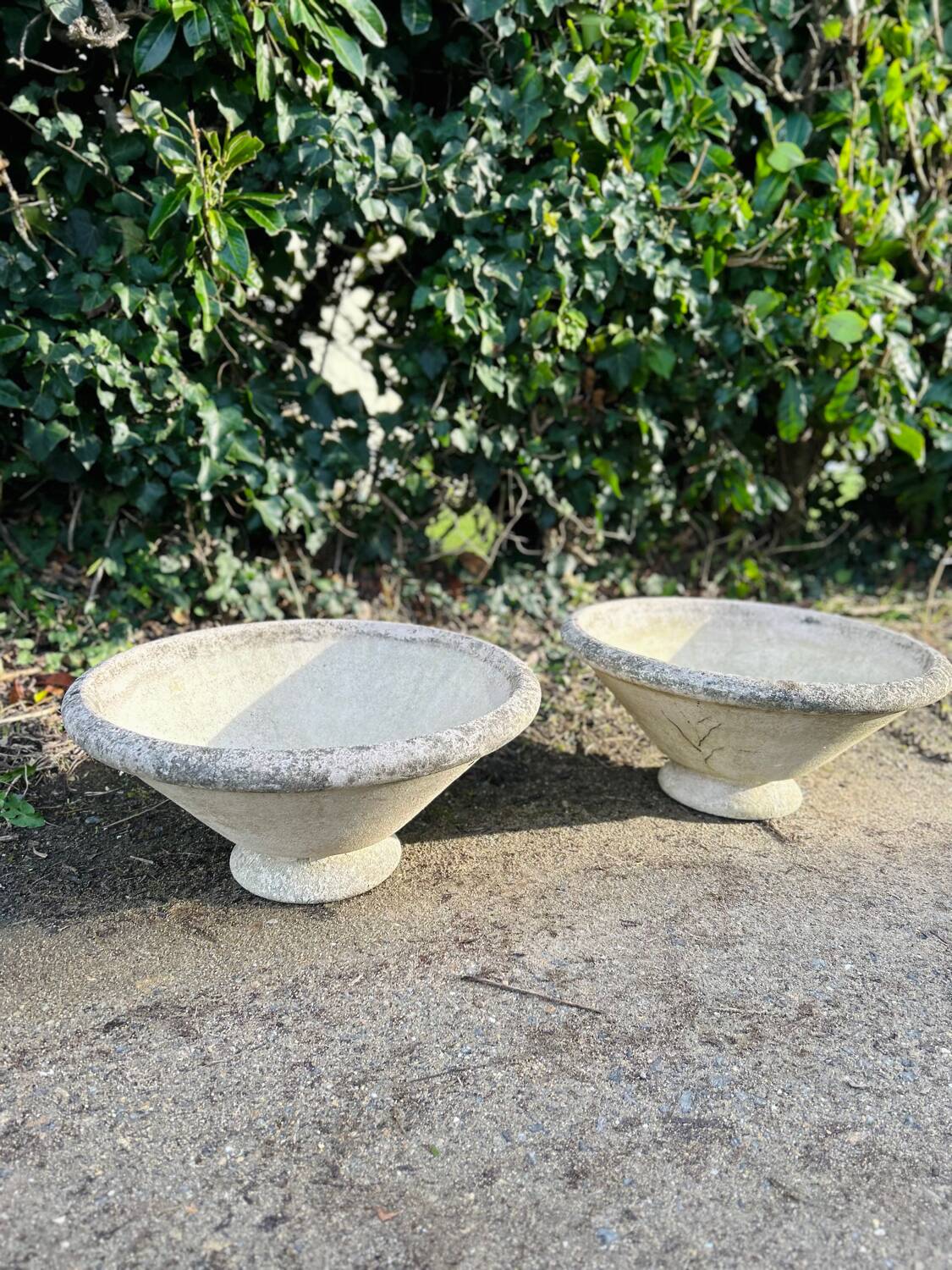 Pair of signed cement garden basins