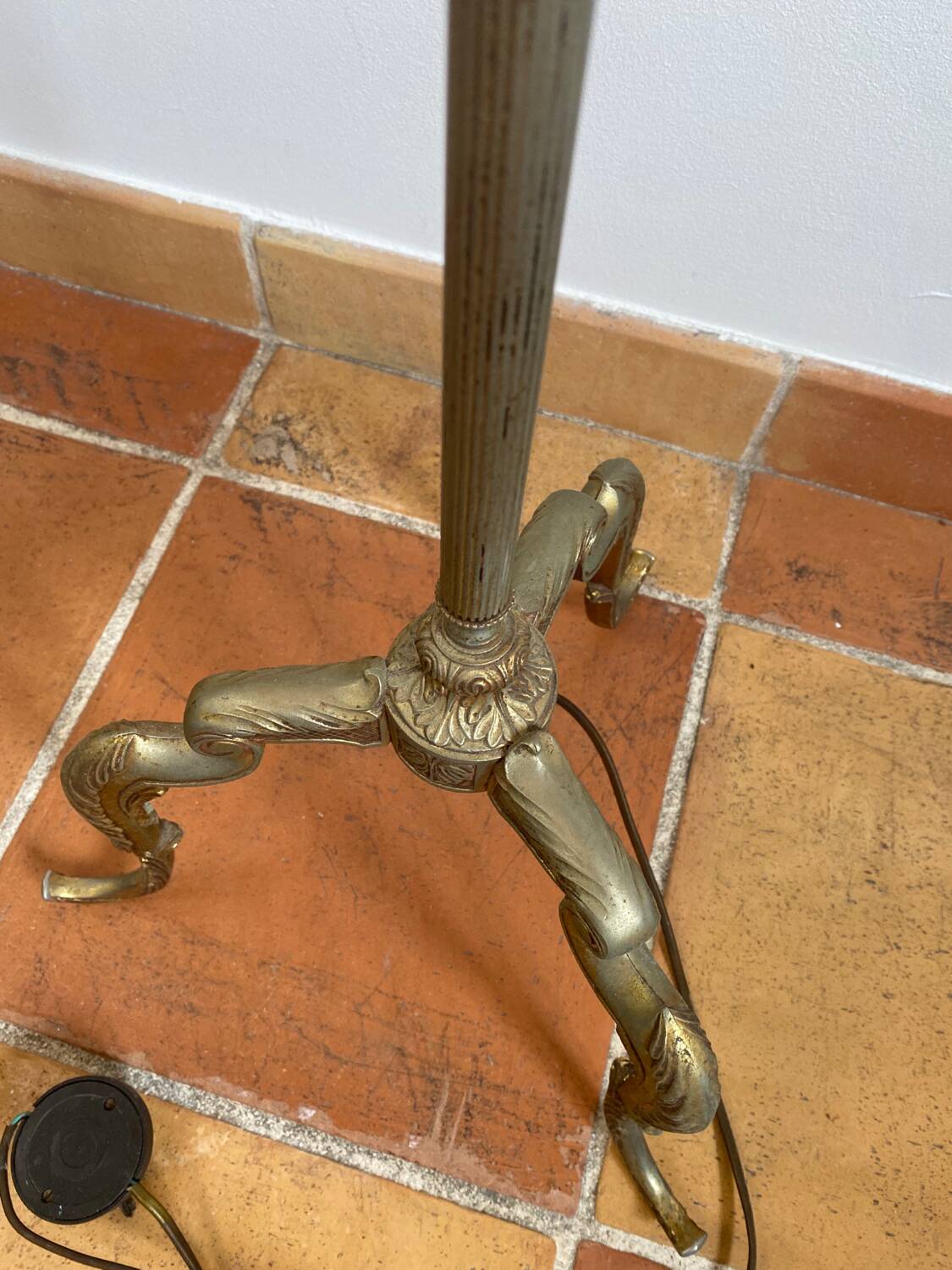 Gold-colored iron floor lamp