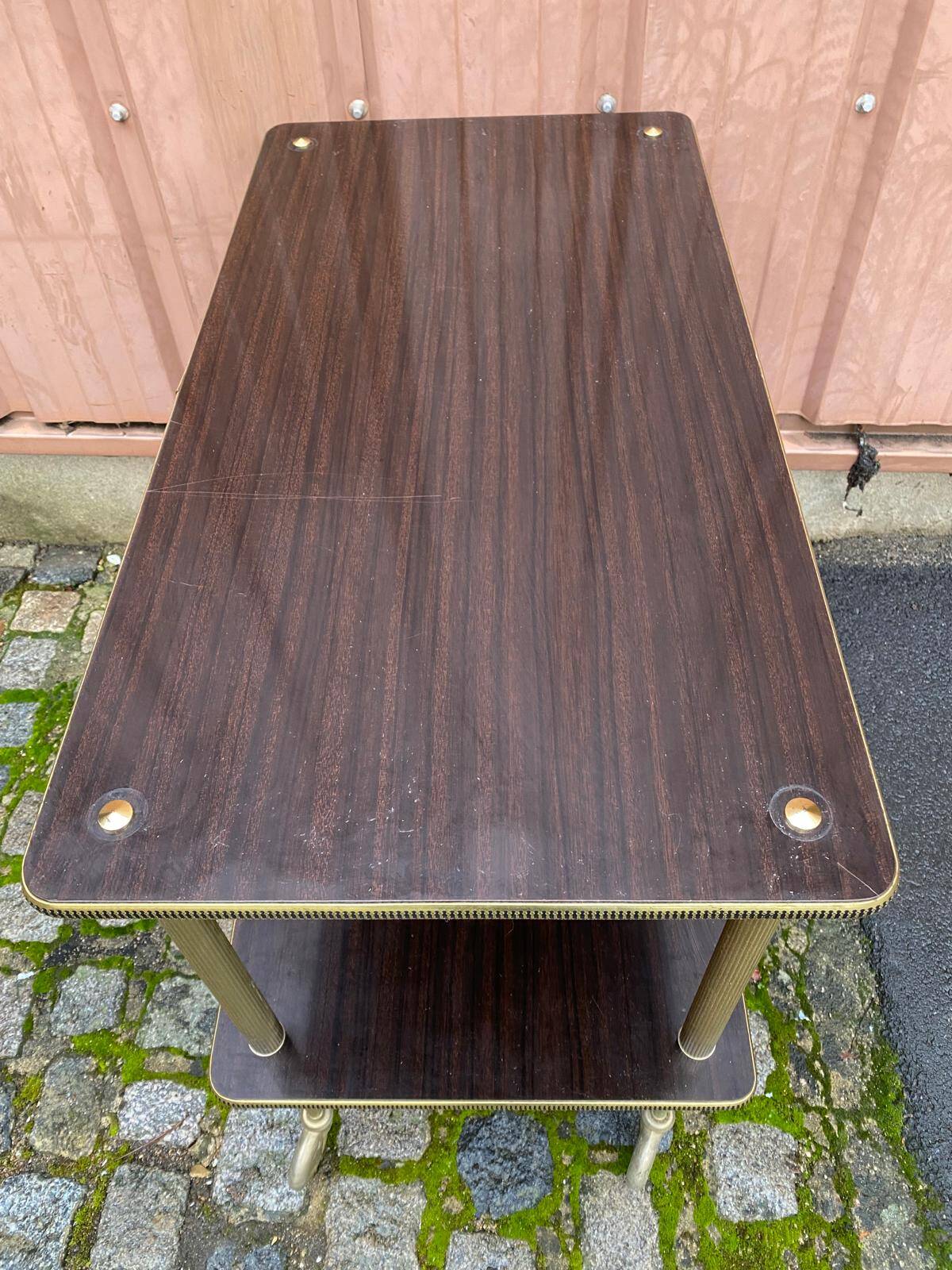 Brown rosewood rolling table with gold fluted legs