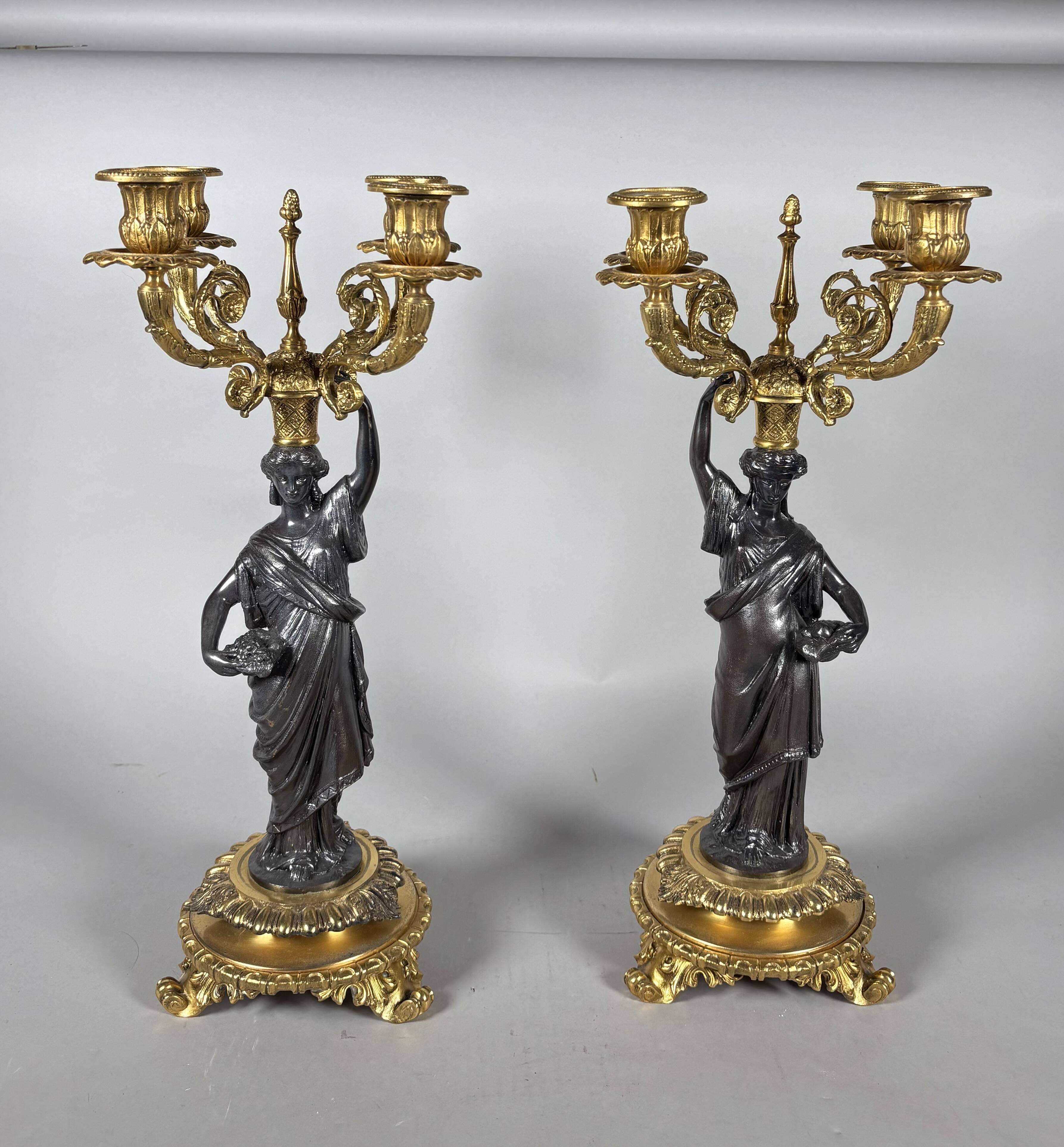 Pair of candelabra with women in the antique style of Napoleon III.