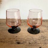 6 small pink glasses with black stems