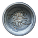 Glazed blue ceramic bowl with stylised fish decoration.