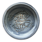 Glazed blue ceramic bowl with stylised fish decoration.