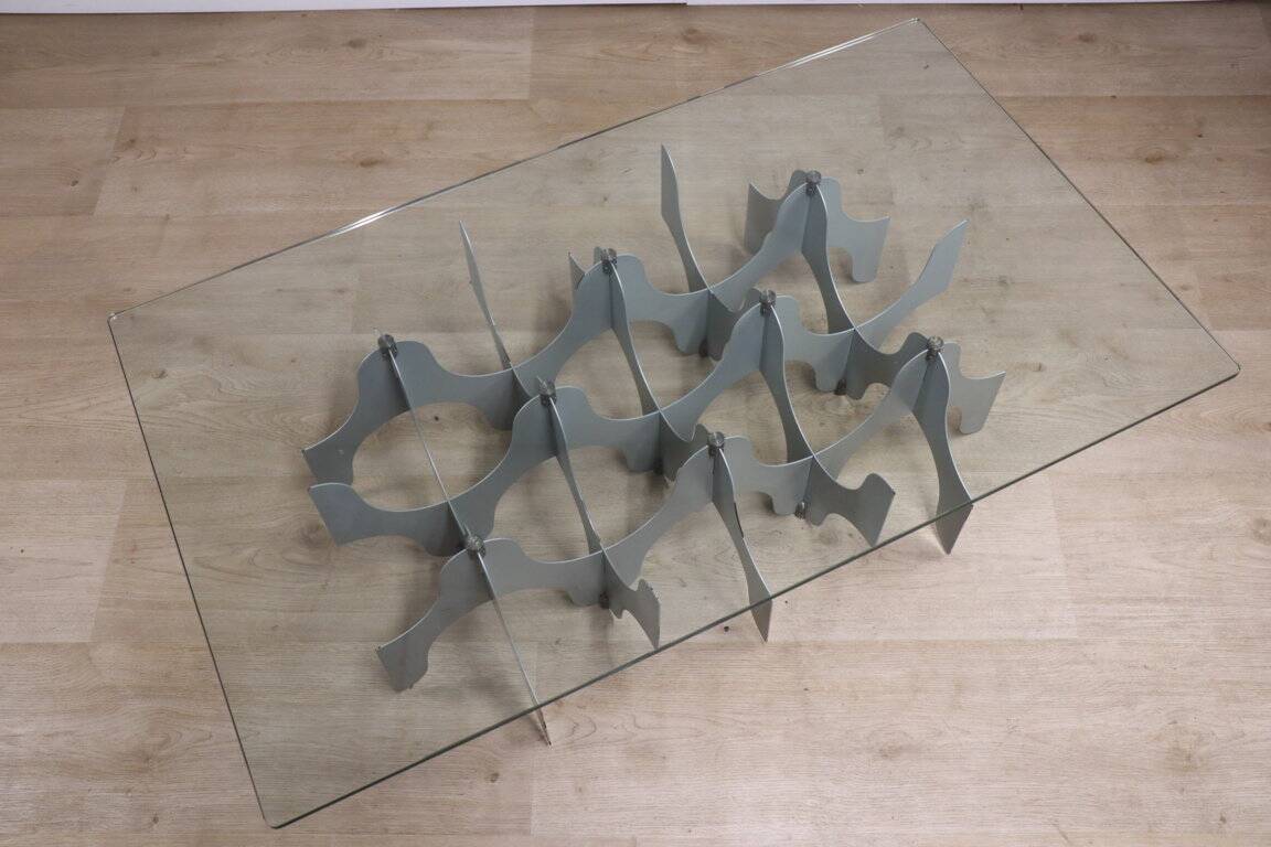 Minimalist sculptural coffee table in metal and glass