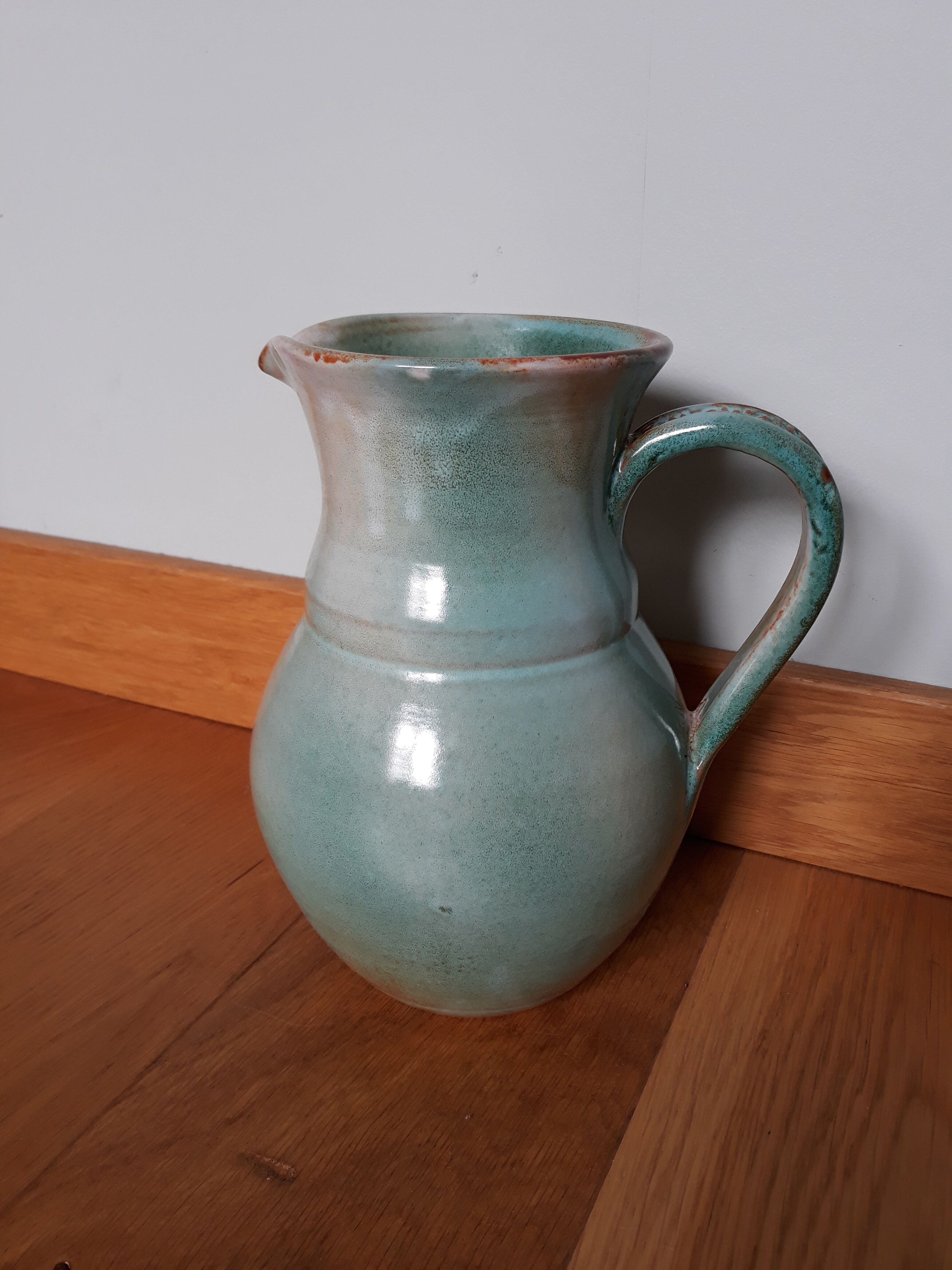 Pitcher with handle green celadon turquoise and caramel