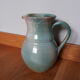 Pitcher with handle green celadon turquoise and caramel