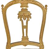 Pair of Louis XVI style chairs in gilded wood.