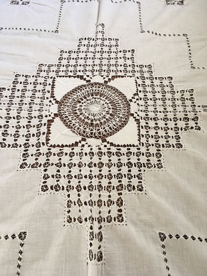 Net-style embroidered cotton tablecloth.