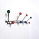 Multicolored wooden and metal coat holder