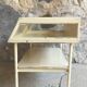 Old showcase on tubular metal feet - early twentieth century