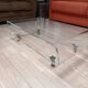 Design coffee table from Habitat in transparent plexiglass, mounted on wheels.