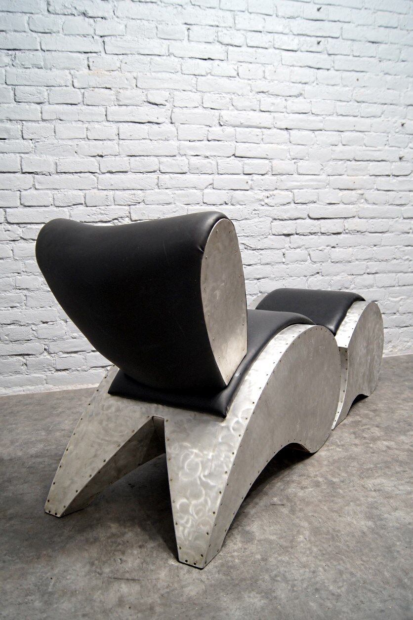 Industrial aluminum & vinyl lounge chair with footrest, 1970s