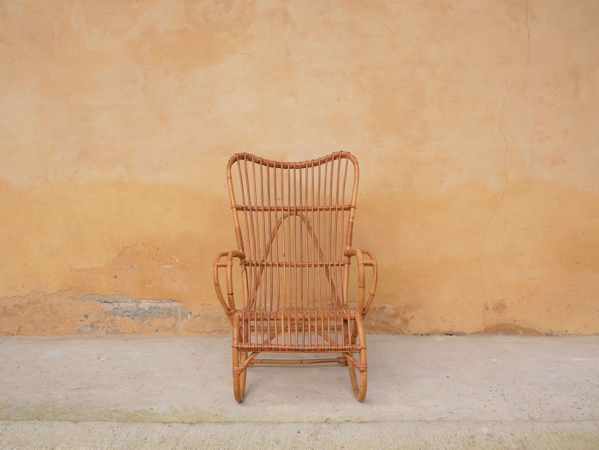 Vintage rattan chair by Louis Sognot