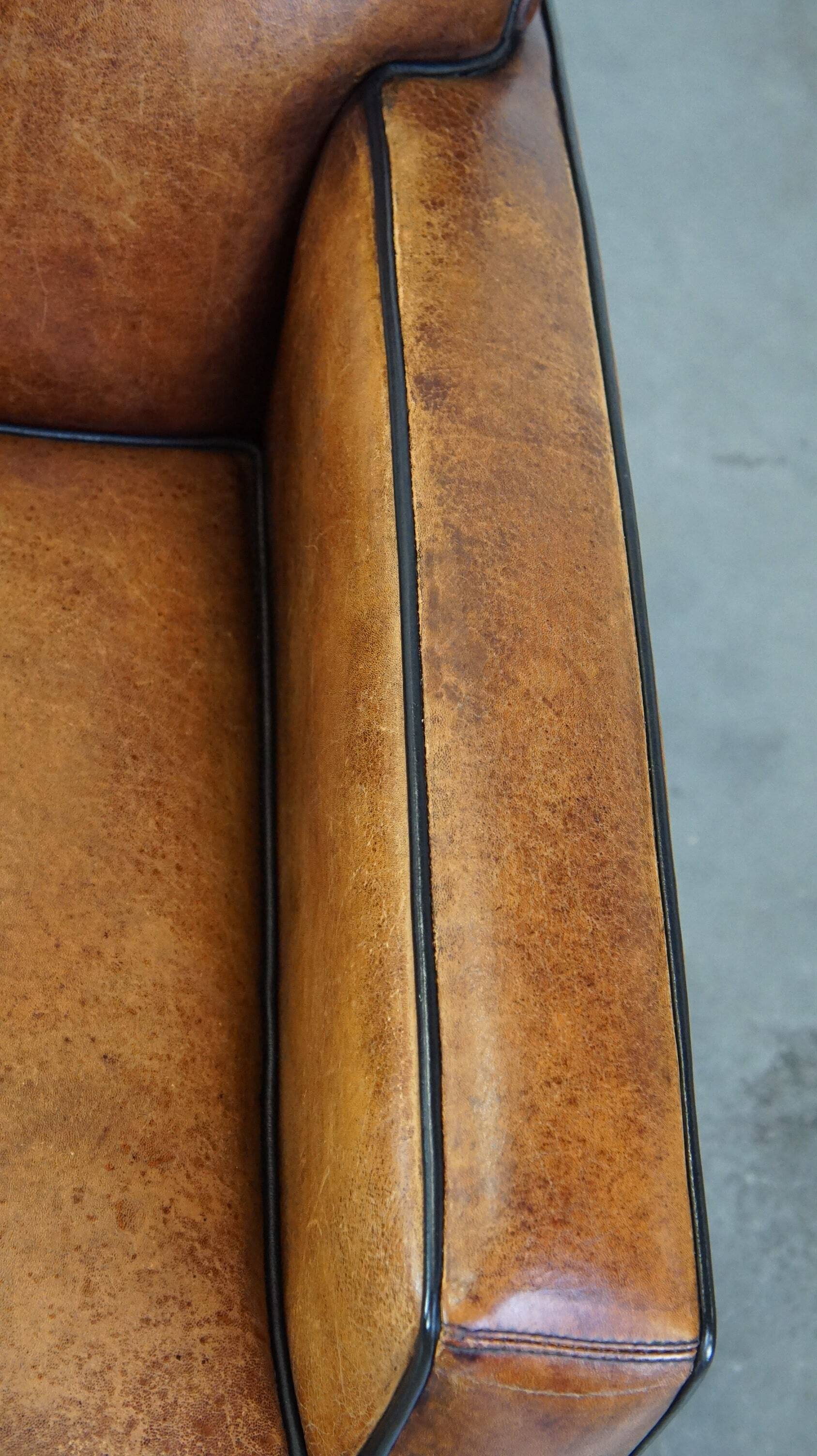 Art Deco sheep leather armchair with a lot of character