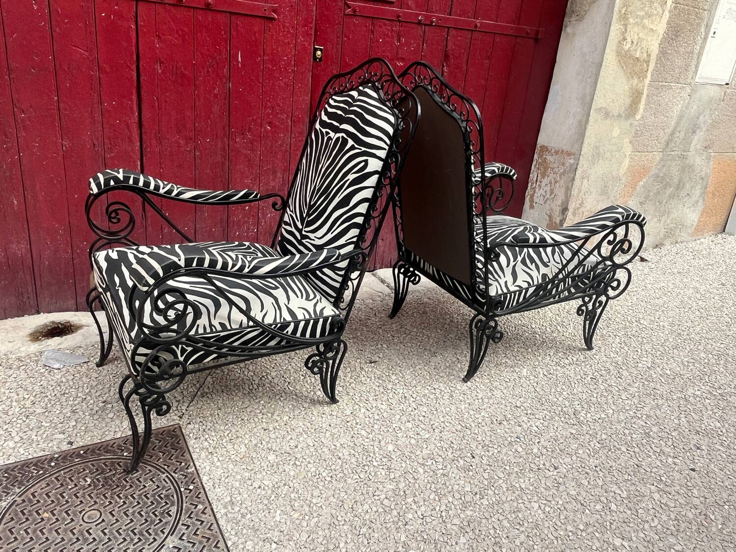 Pair of wrought iron armchairs