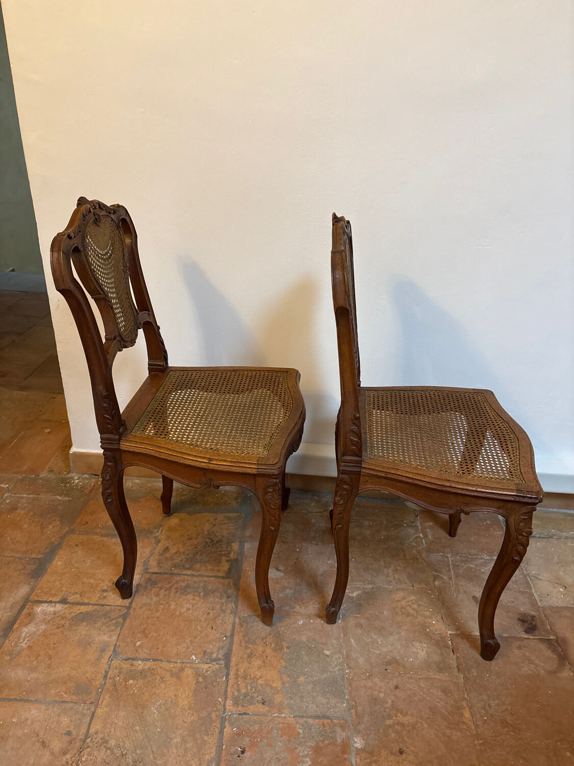 Pair of Louis XV style chairs in wood and caning.