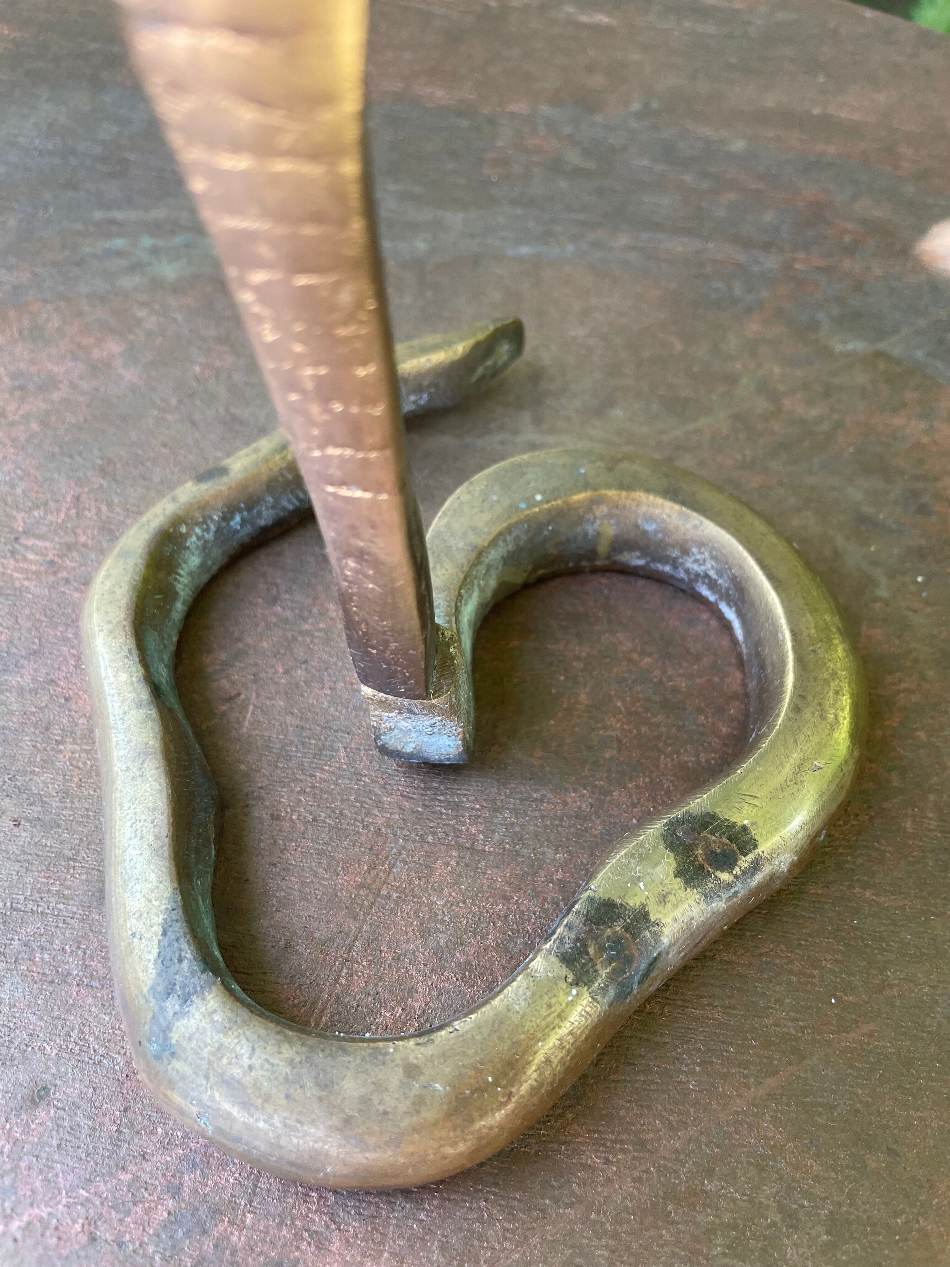 Cobra candlestick in Latvian
