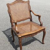 Fauteuil canné sculpté style Régence