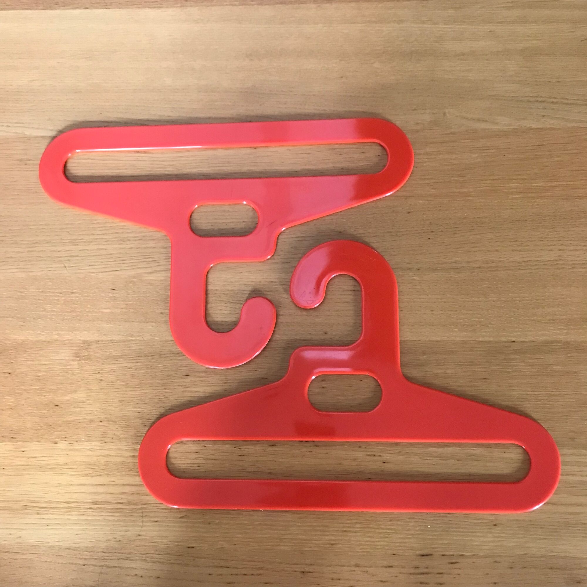 Pair of vintage orange hangers Prisunic