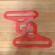 Pair of vintage orange hangers Prisunic