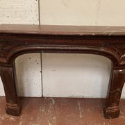 Pair of Louis XIV style fireplaces in red cherry marble. XIX century.