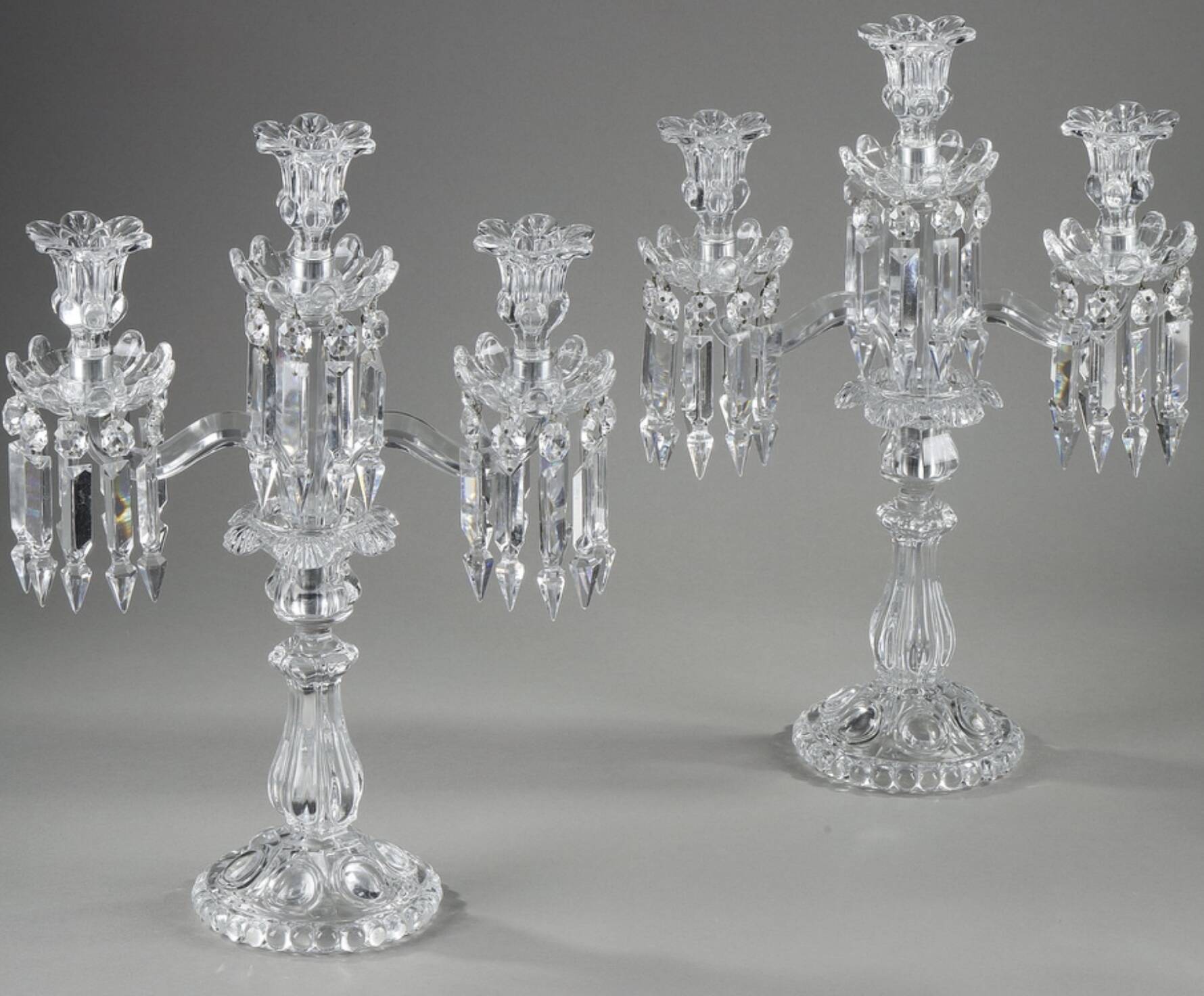 Pair of Baccarat three-light crystal chandeliers