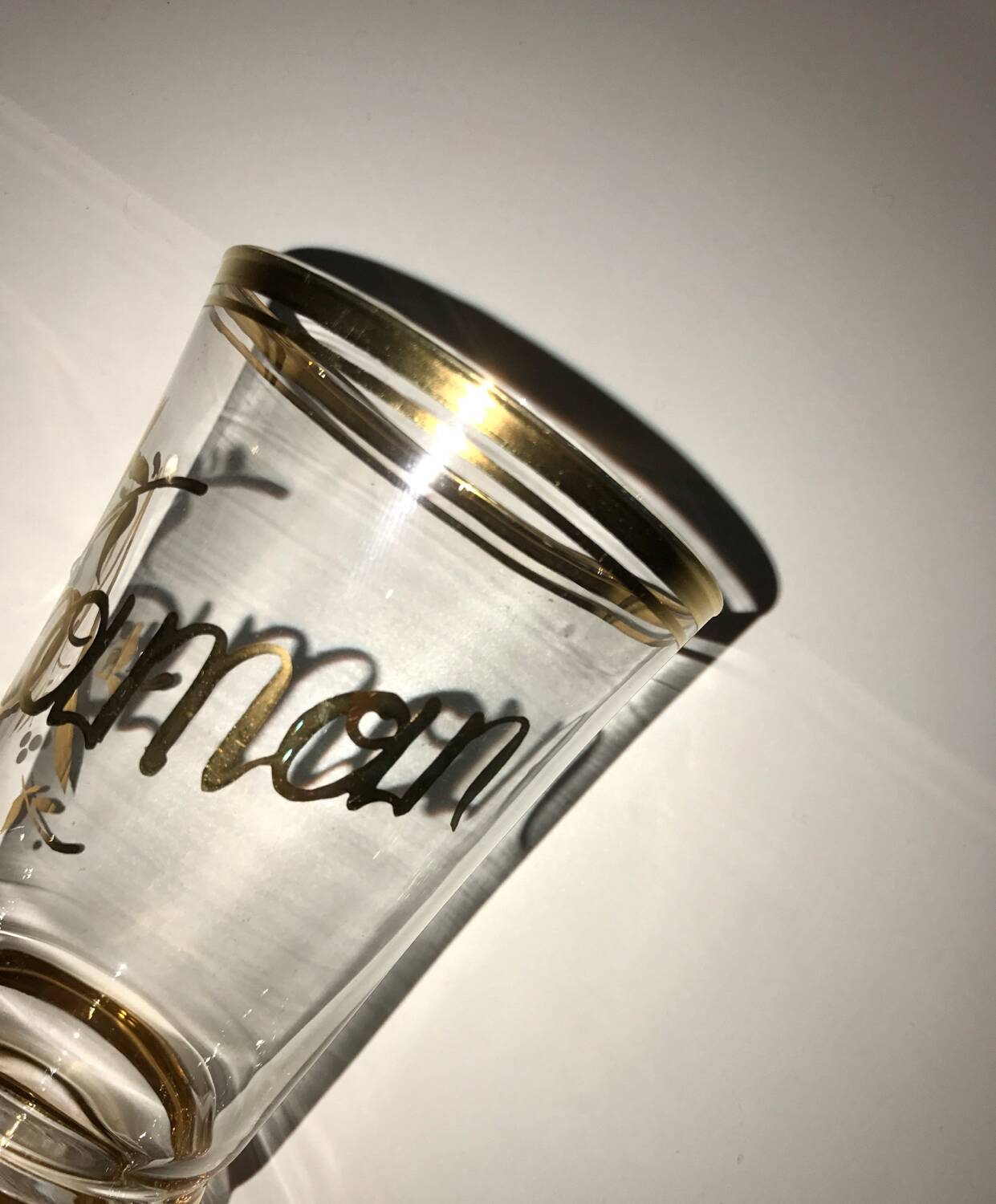 Antique gilded glass with the inscription Maman