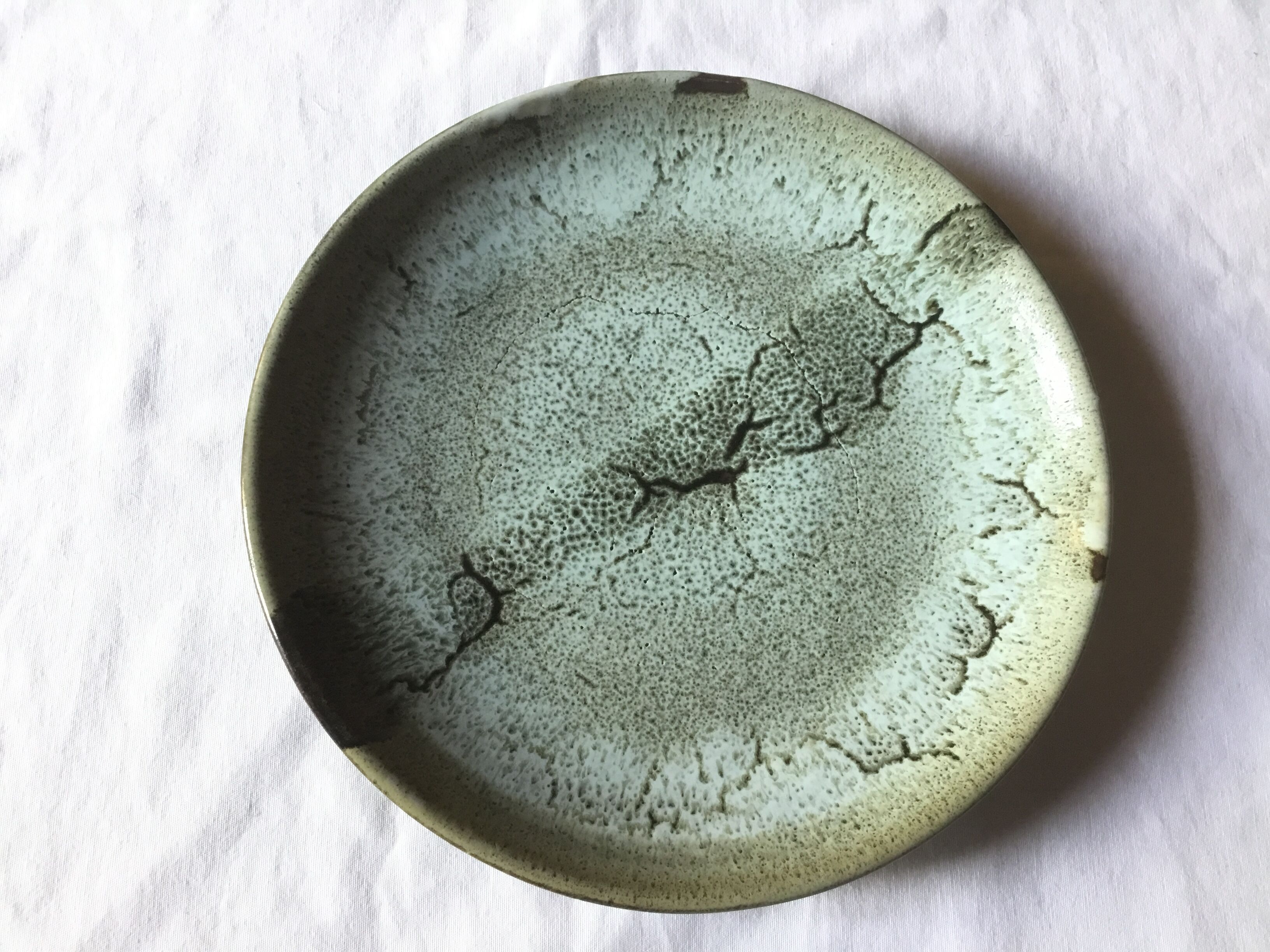 Emailed sandstone plate