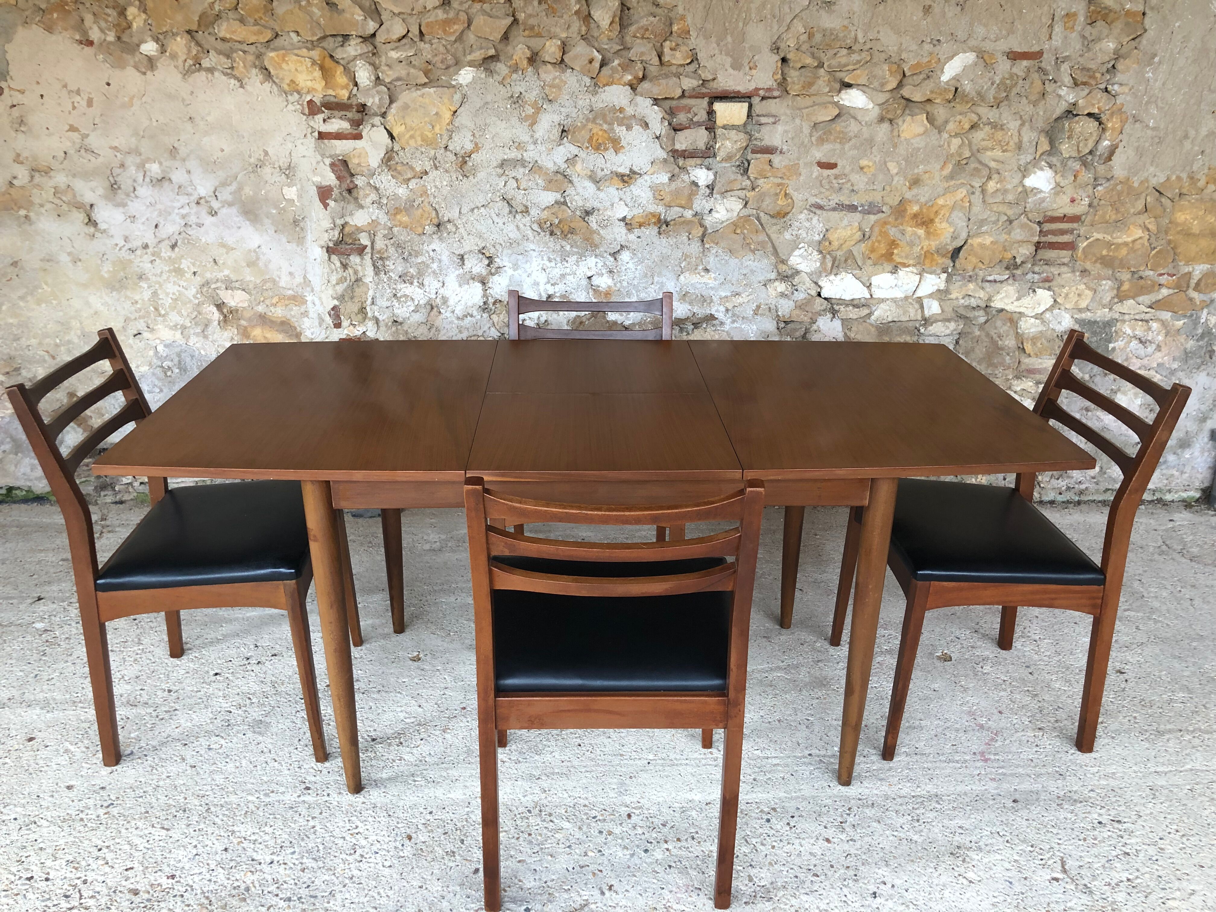 Scandinavian extension teak stretch table in butterfly ephardt by Meredew circa 60's