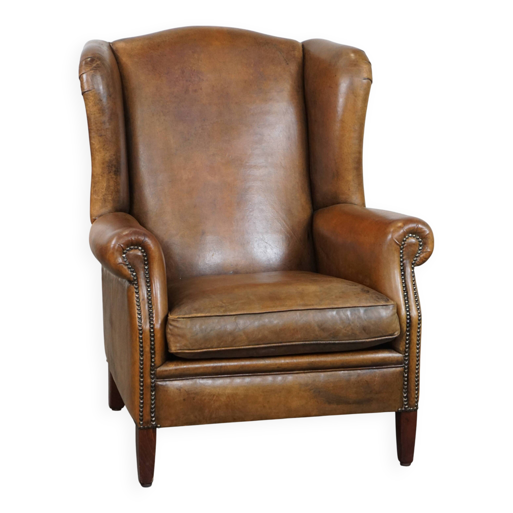 Sheep leather wingback chair with patina