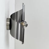 Pair of vintage wall lights, curved patinated steel, France, 1970.