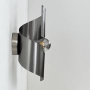 Pair of vintage wall lights, curved patinated steel, France, 1970.