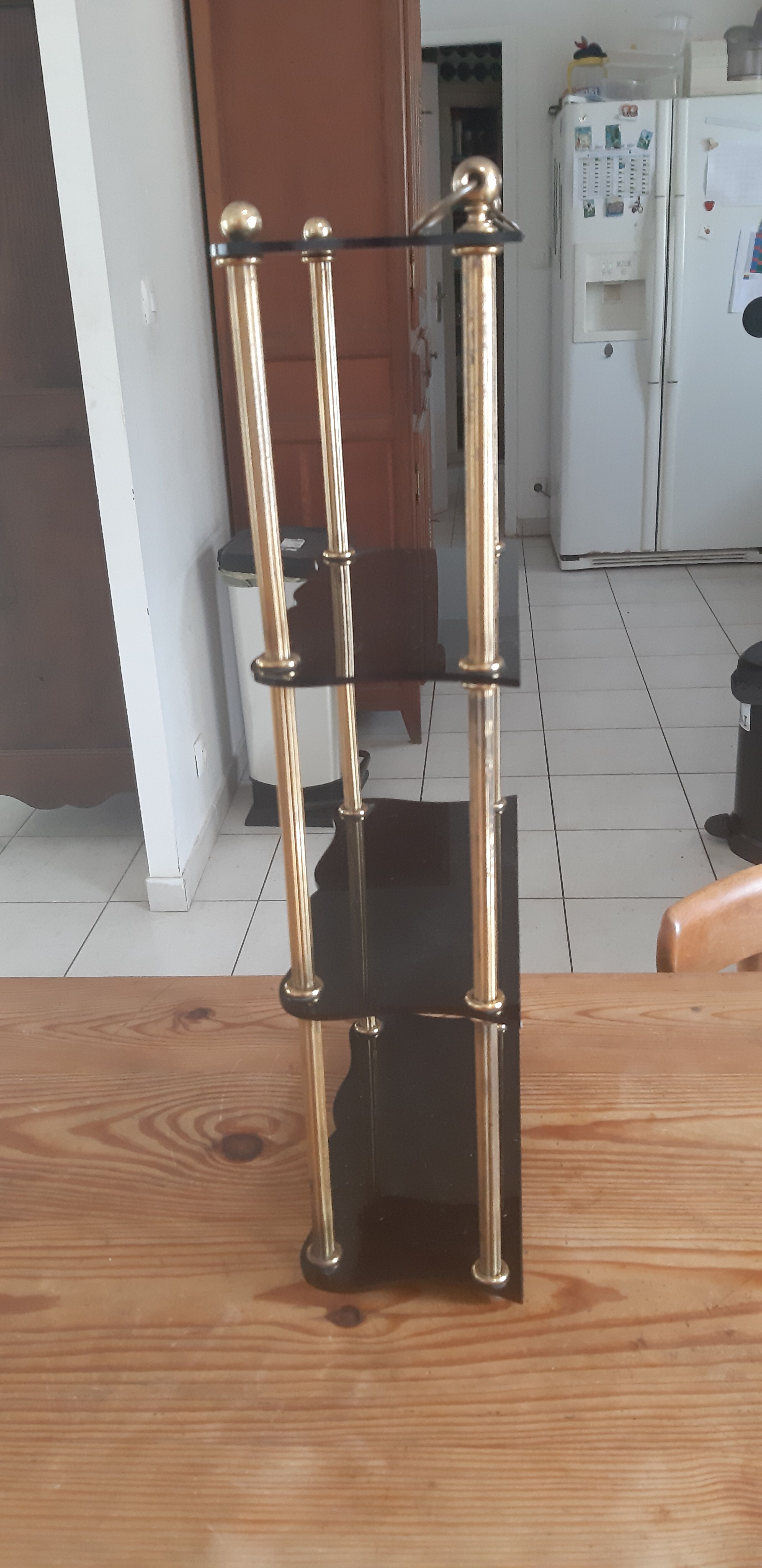 Vintage shelf of the 60s in golden metal and black plastic