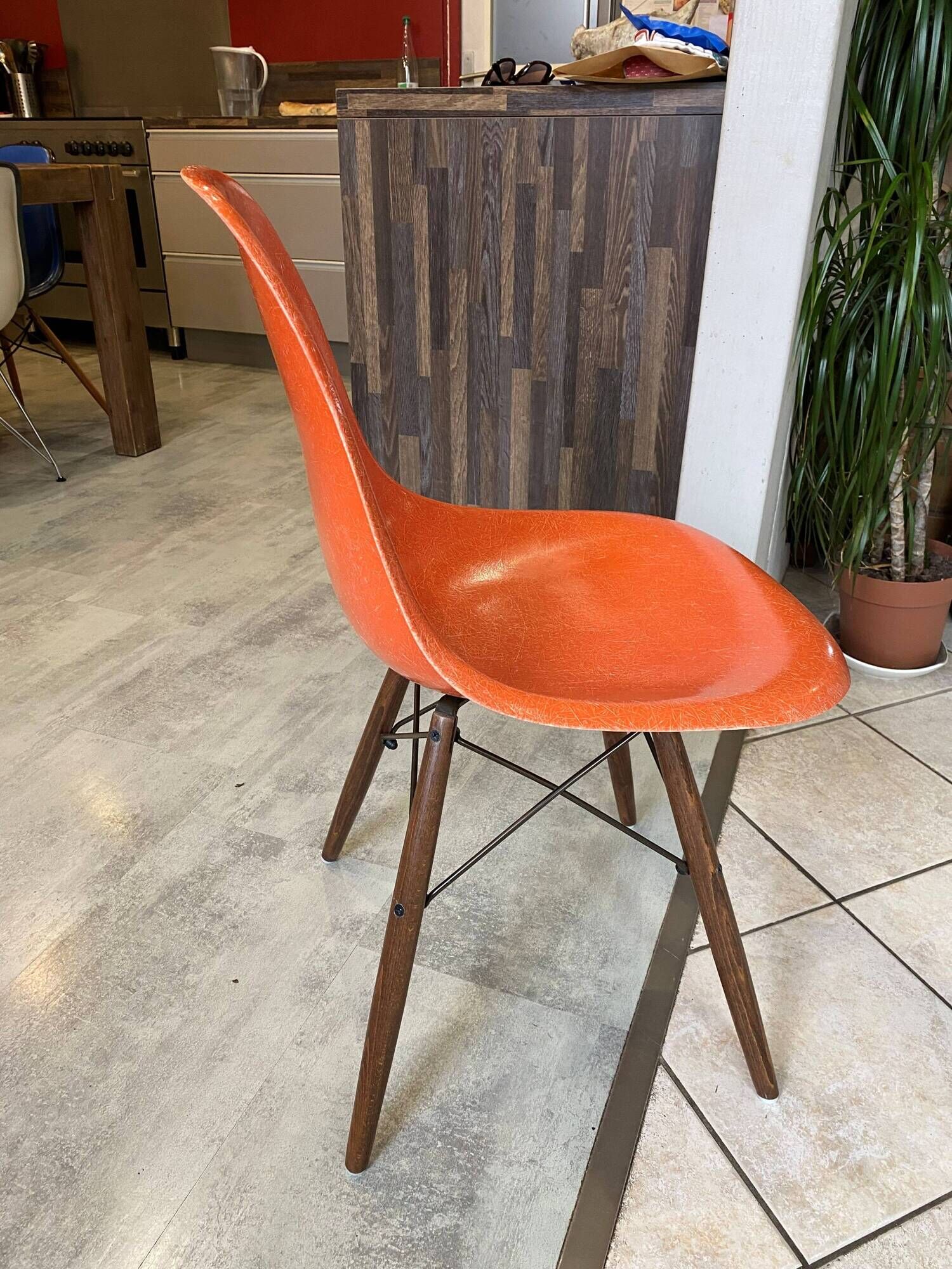 A vintage 70s Eames Herman Miller DSW Fiber Red Orange Dowel Walnut Chair