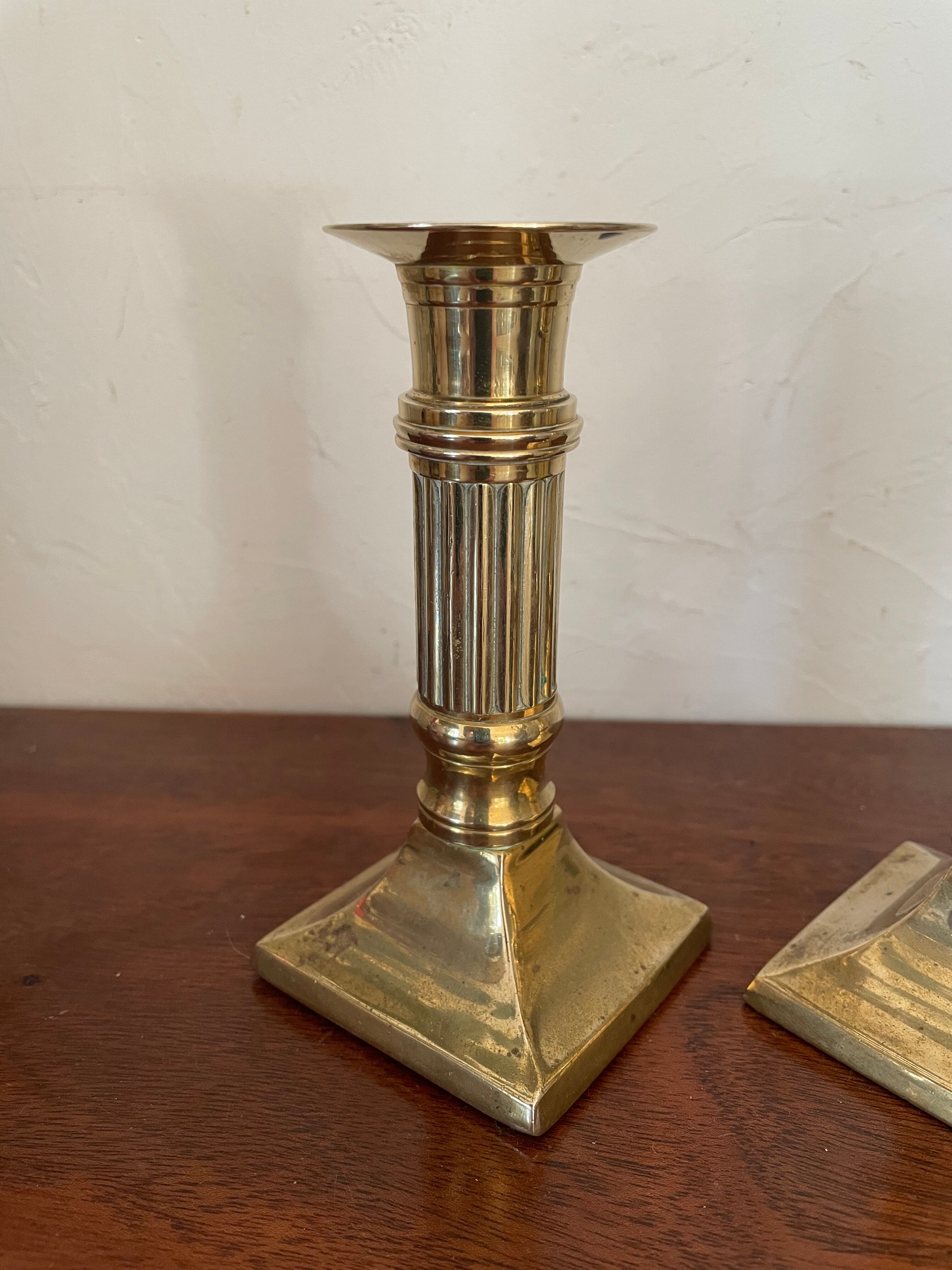 Pair of brass column candle holders