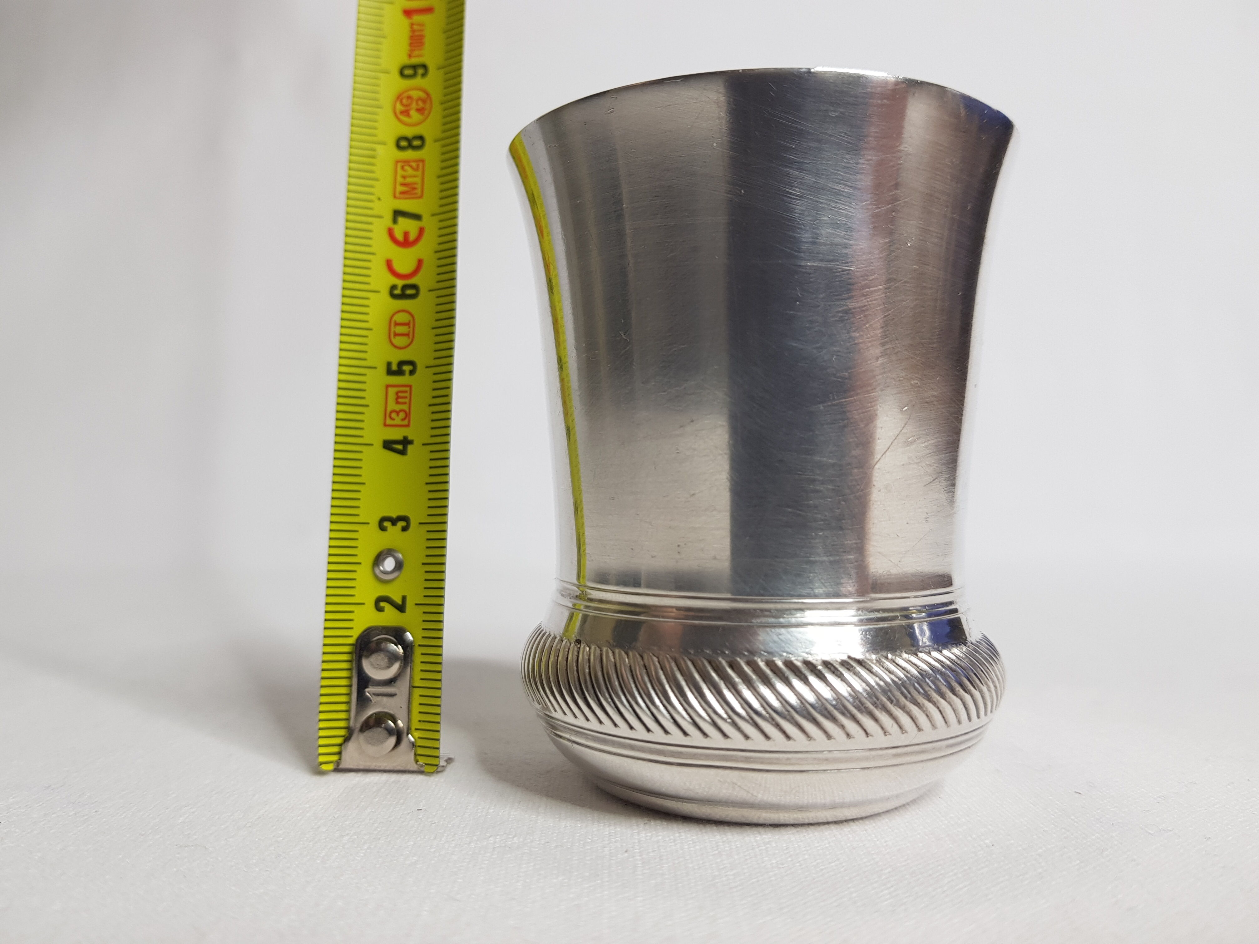 Old silver metal timbale with punch