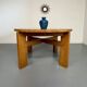Extendable round table Maison Regain in solid elm, 1970s design.