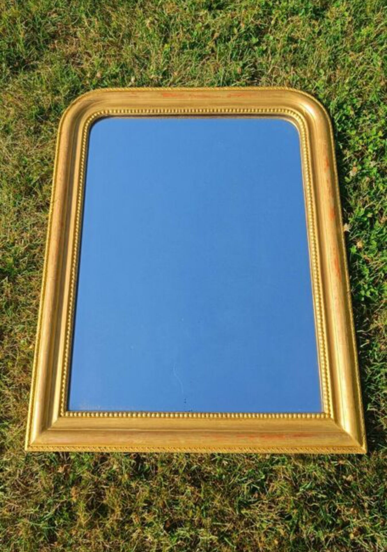 Antique Louis-Philippe mirror, gilded and patinated.