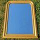 Antique Louis-Philippe mirror, gilded and patinated.